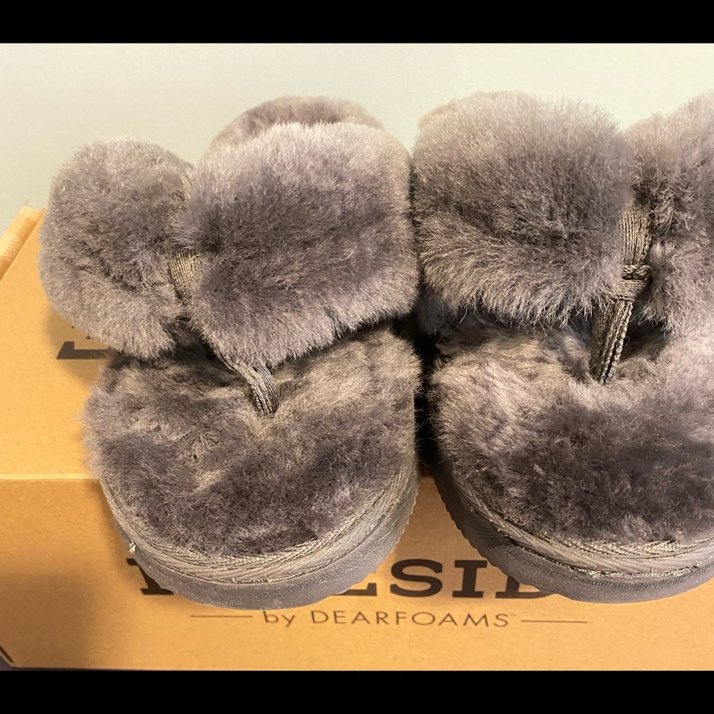 Gray furry slippers worn one time.